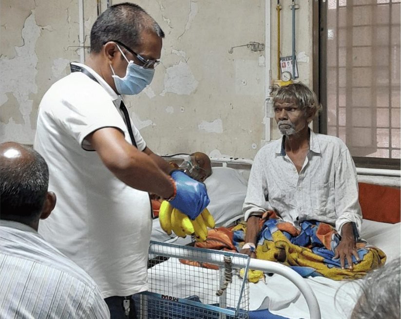 Volunteer with a patient at hospital